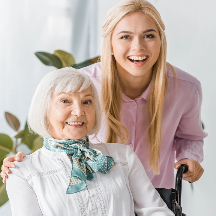 Young with with elderly mother in wheelchair